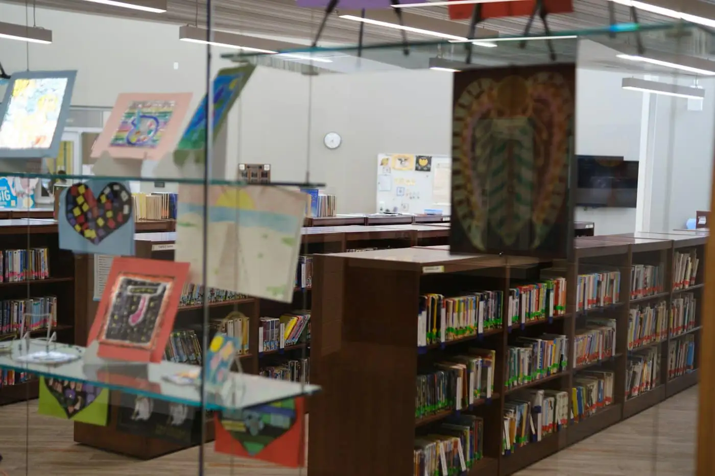 Children’s artwork displayed in the library corner